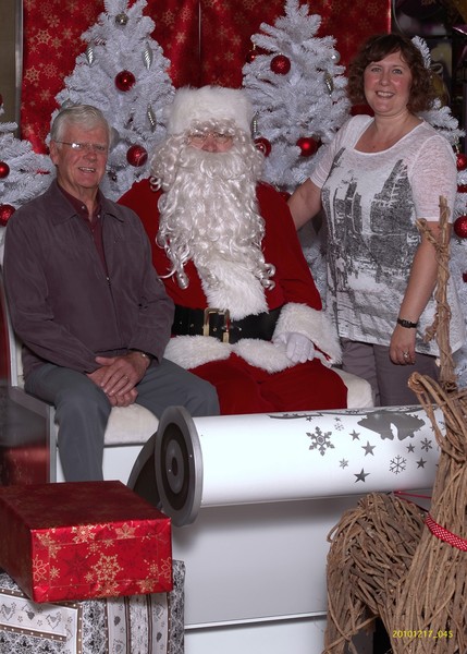 Don Brebner of Tauranga Foodbank with Bayfair Shopping Centre Marketing Manager Nina Rivett and Santa